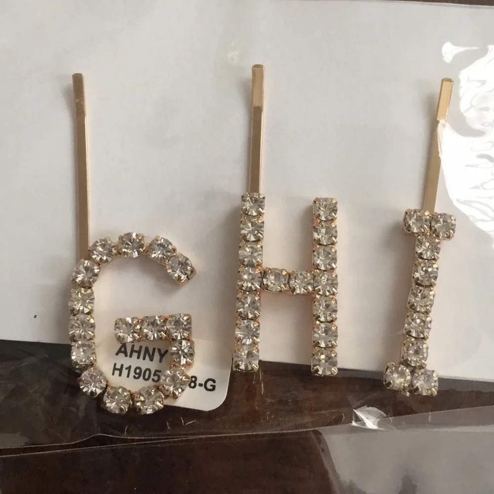 Anthropologie‎ rhinestone initial barrettes. Great!